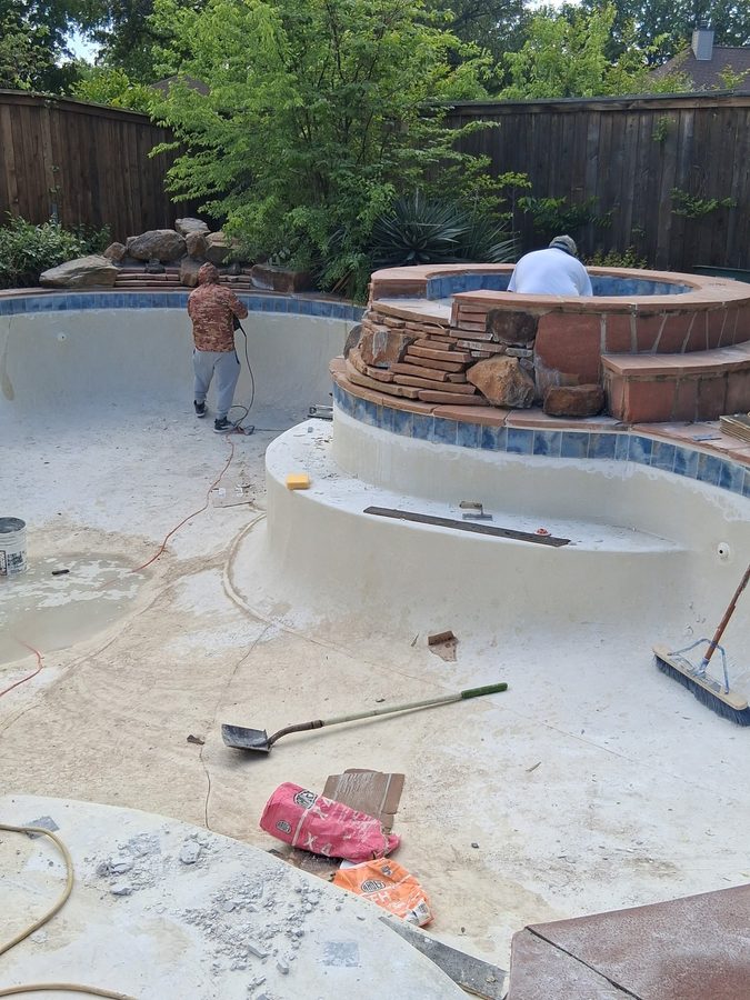 Crew installing stonework